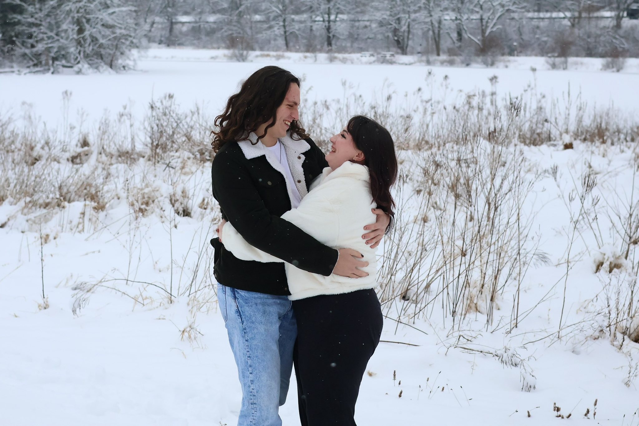 Couple laughing in the snow